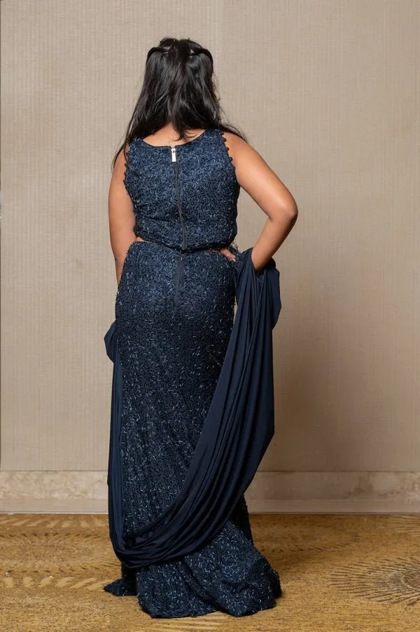 Exquisite navy blue crop top and Lahenga with intricate beadwork and dramatic sleeves, perfect for making a sophisticated statement at formal events.